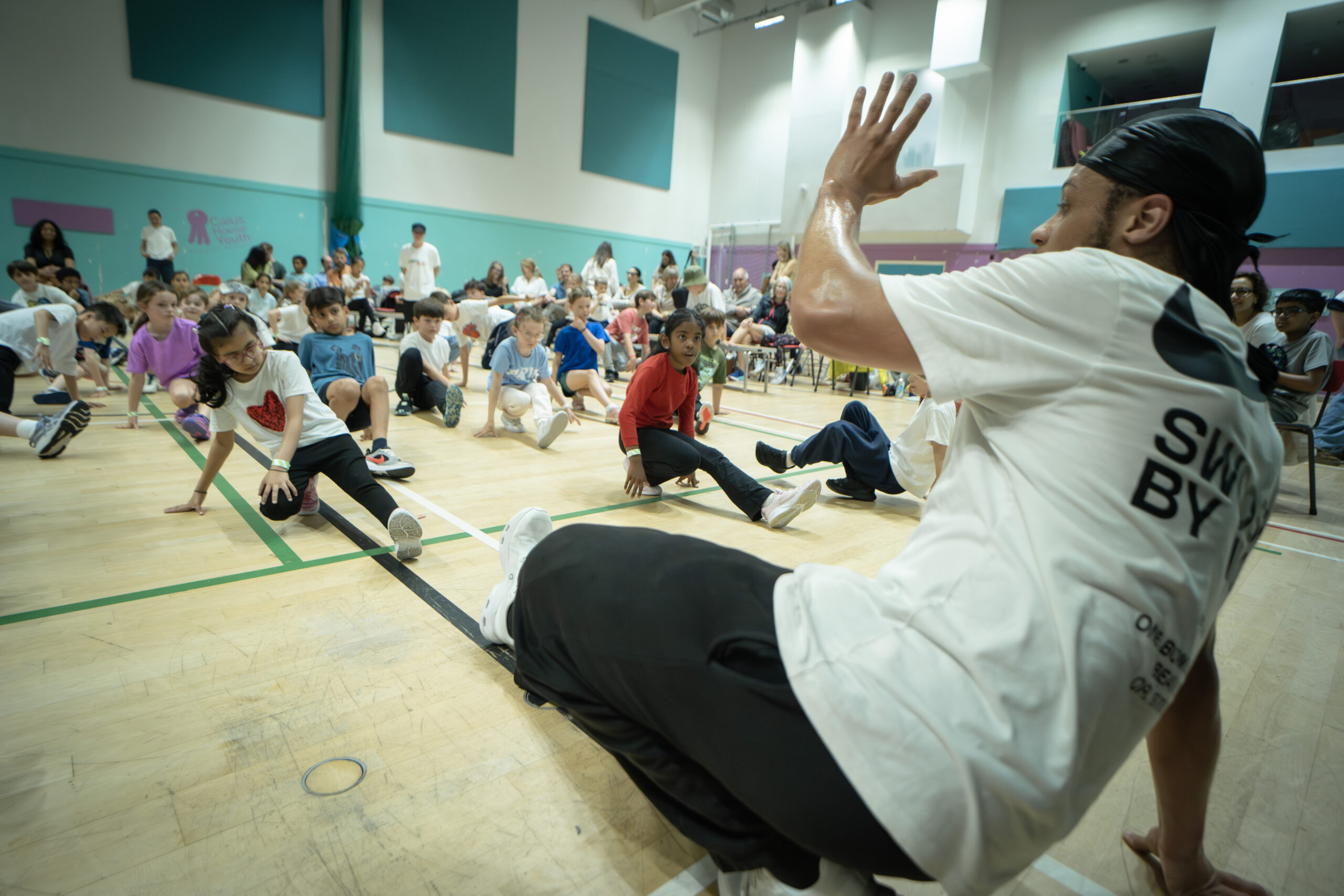 Marcus teaching students break dancing